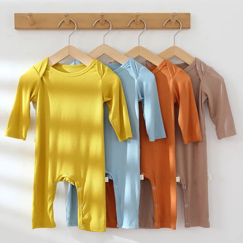

Newborn clothes 2022 spring and autumn girls solid color long-sleeved rompers boy baby modal home clothes jumpsuit