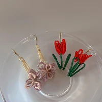 allnewme hyperbole rainbow beaded flower long drop earrings for women handmade hollow floral tulip hanging earring party jewelry