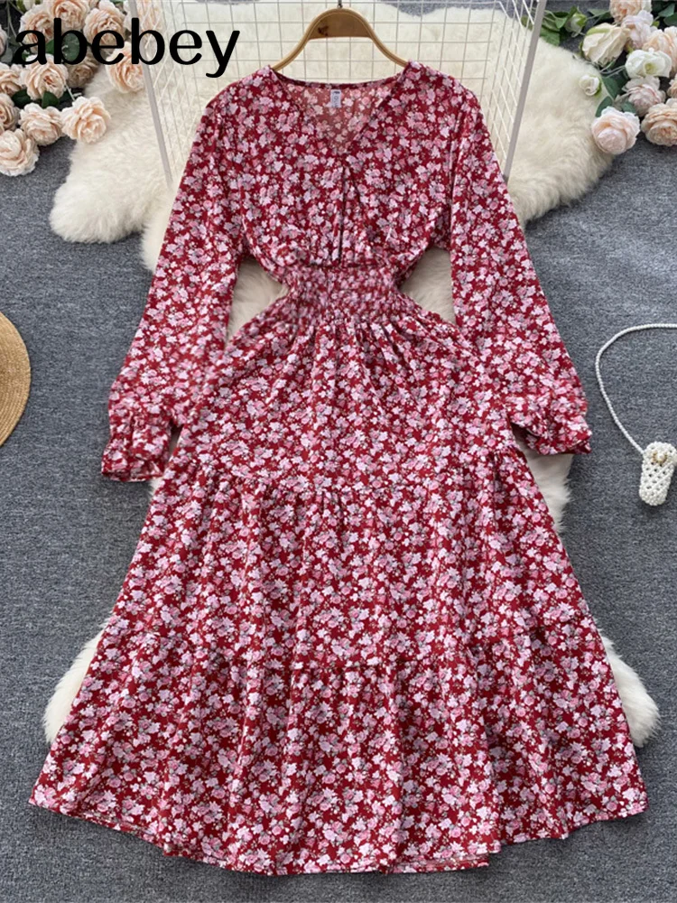 

Женское длинное платье с рукавами-фонариками, эластичным поясом и цветочным принтом