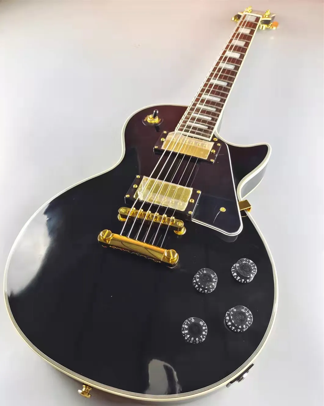 

Custom electric guitar, mahogany body, gold accessories and pickups, in stock, including mail