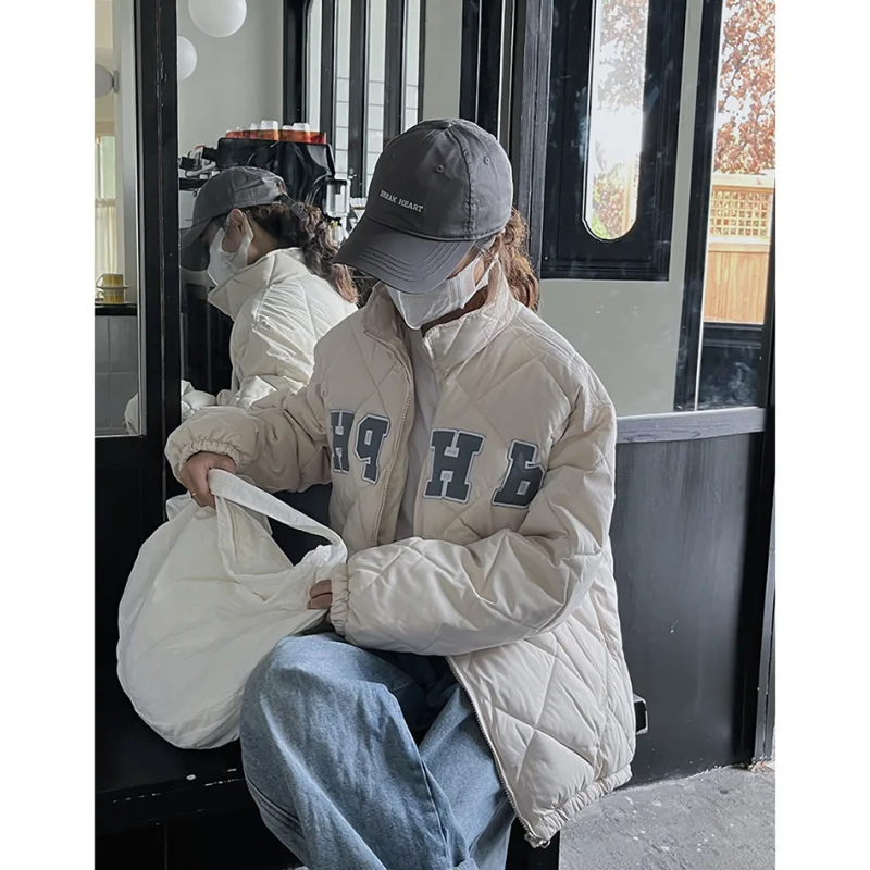 Женский зимний пуховик с вышивкой и защитой от ветра