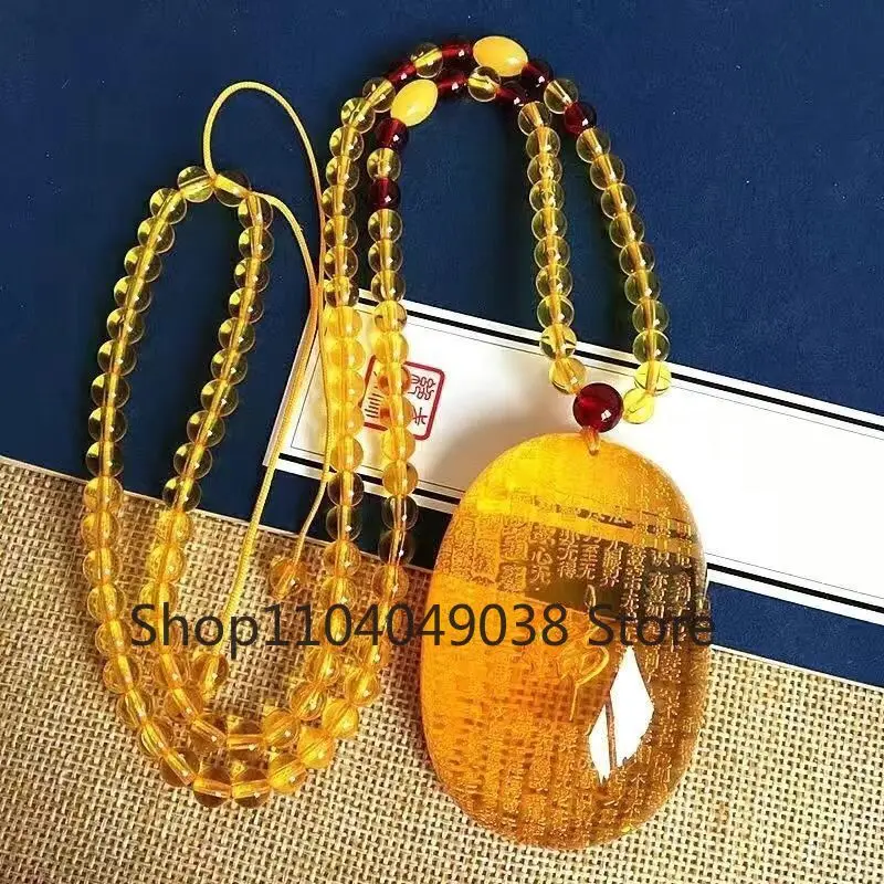 Подвеска из янтарного пчелиного воска в форме сердца с сутровым лотосом