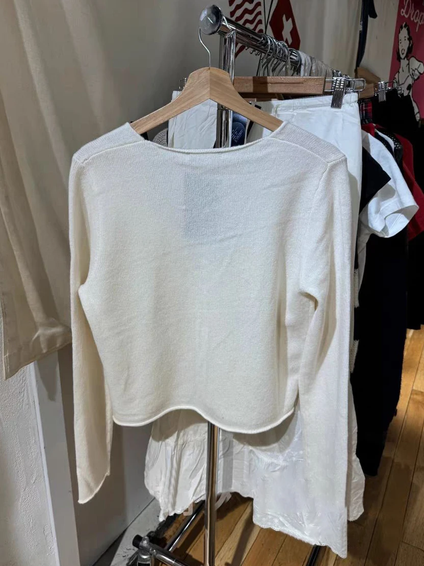 Вязаный кардиган с ажурным подолом бежевый однобортный хлопковый укороченный