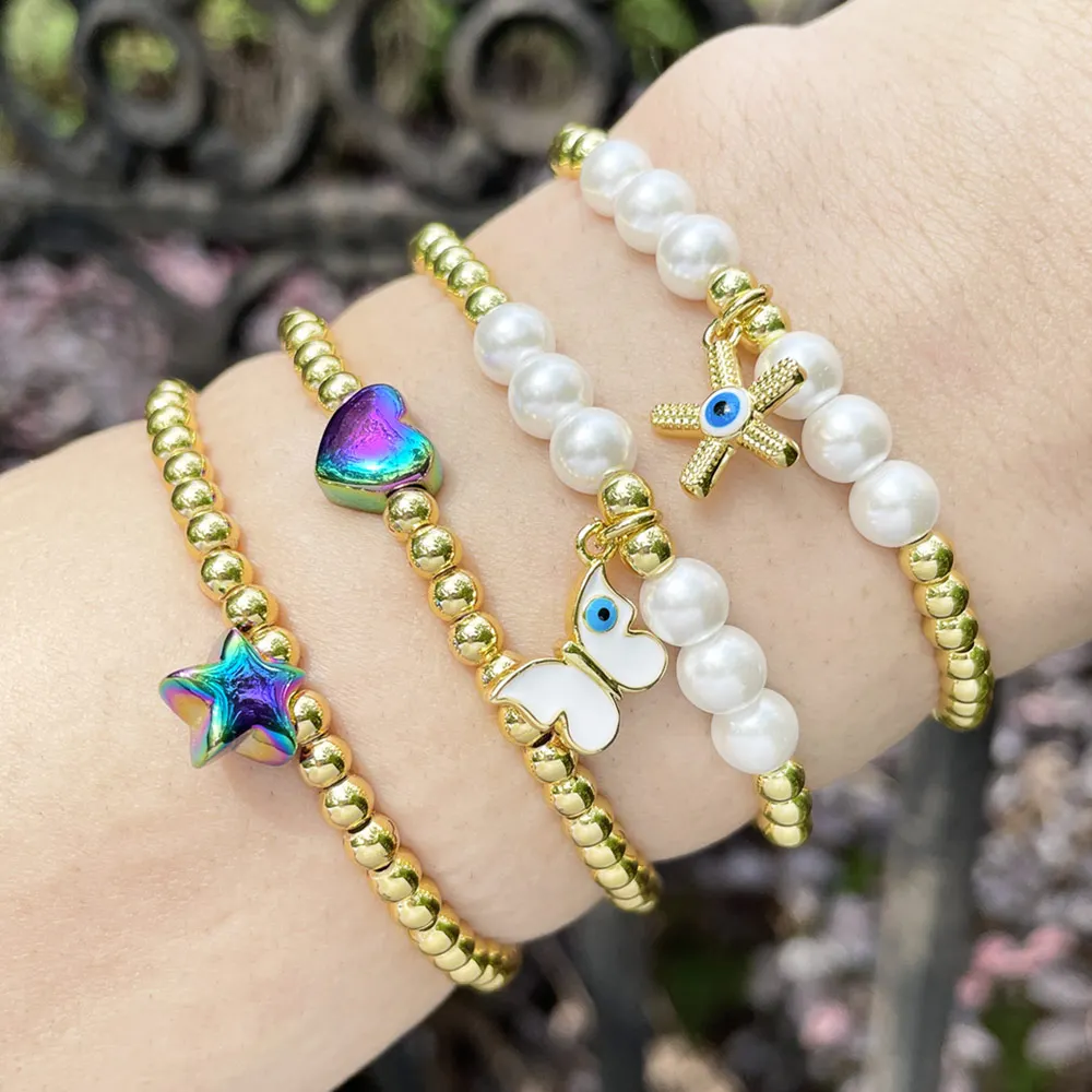 

FLOLA White Pearl Blue Eye Bracelets for Women Copper Gold Plated Beads Rainbow Star Heart Bracelets Wholesale Jewelry brth49