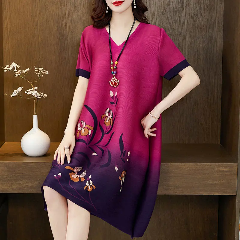

Pleated dress female 2022 new summer loose thin foreign air age-age short sleeve print A word skirt large size women's clothing