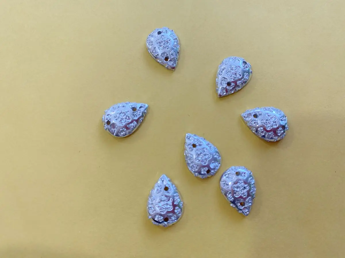 

sew on rhinestones 10*14mm drop shape silver stones 2 holes flatback gem stones 100pcs/lot