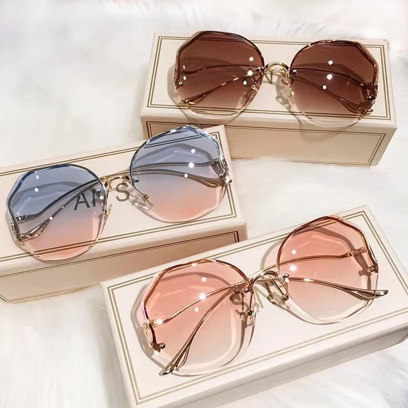 

2022 Fashion Brown Gradient Sunglasses Women's Frameless Trimmed Lens Metal Curved Temple Sunglasses Women UV400
