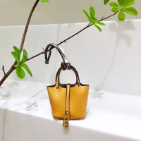 2022 new h home vegetable basket bag pendant creative headphone car keychain leather mini bucket bag pendant female