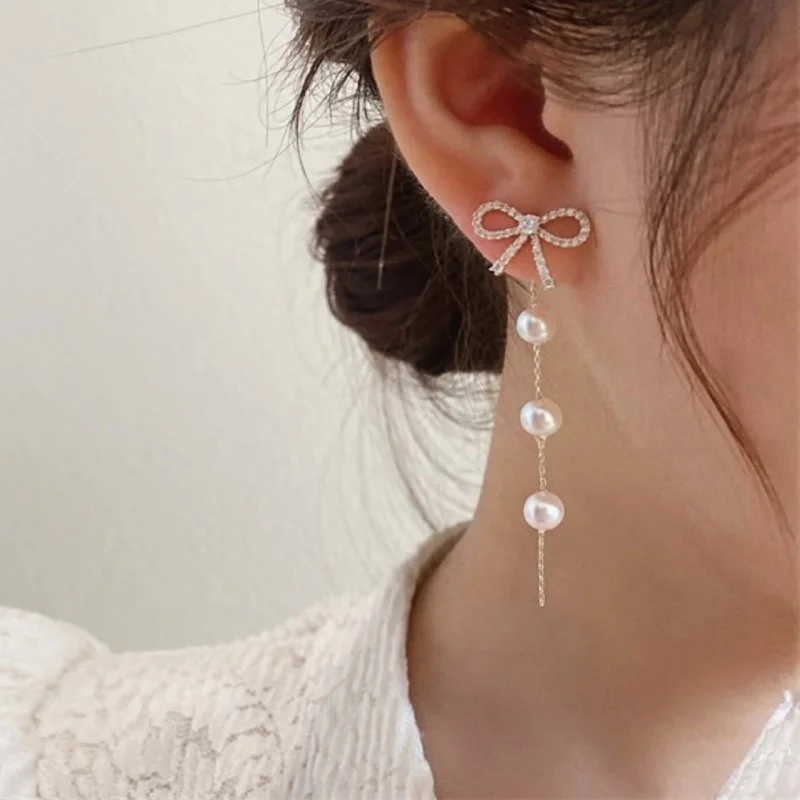 

2023 Super Immortal Gentle Bow Tie Earrings Light Luxury Long Style Tassel Pearl Show Face Thin Earrings Women's Trend