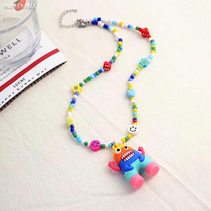 

New little monster smiley face cotta necklace summer flower beaded sweater chain beautifully designed personality necklace