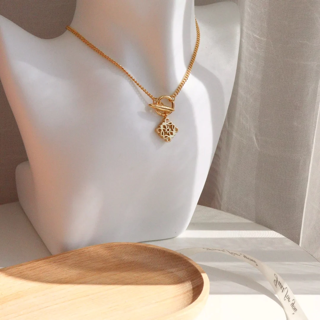 

Roy's new geometric necklace, the Rowway necklace, square-shaped carved cutout vintage Ladies banquet necklace