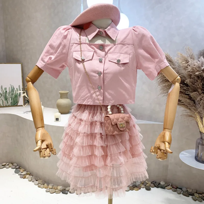 

Niche Design New Women's Clothing 2022 Summer Short Sleeved Hollow Out Top + High Waist Cake Mesh Skirt Two-piece Set