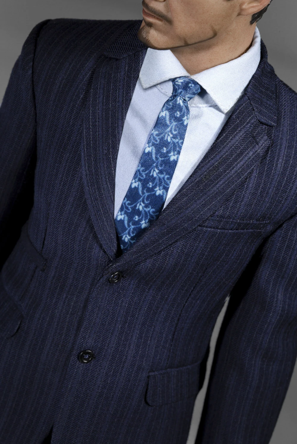 D. D. Suits arm. Savile row suit. Tony dealer.