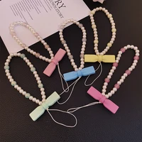 mobile phone lanyard short wrist bow tie pearl womens pendant exquisite pendant keychain anti lost sling light luxury chain