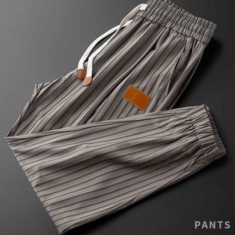 

Light luxury summer thin yarn-dyed vertical stripe sports pants men's slim-fit bundle foot elastic drawstring casual nine-point