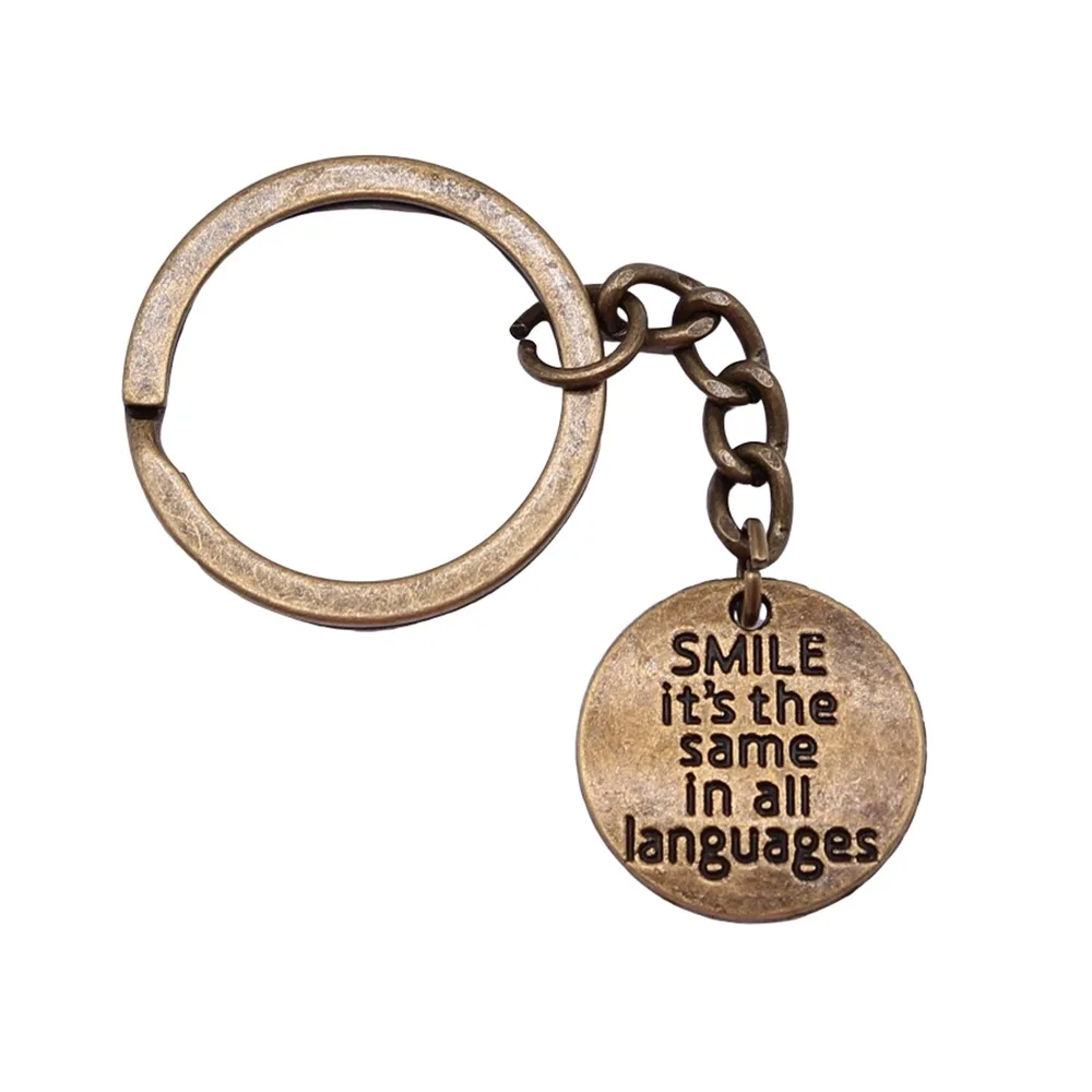 Сувениры подарок мужской брелок 2 цвета 20 мм улыбка такая же на всех языках