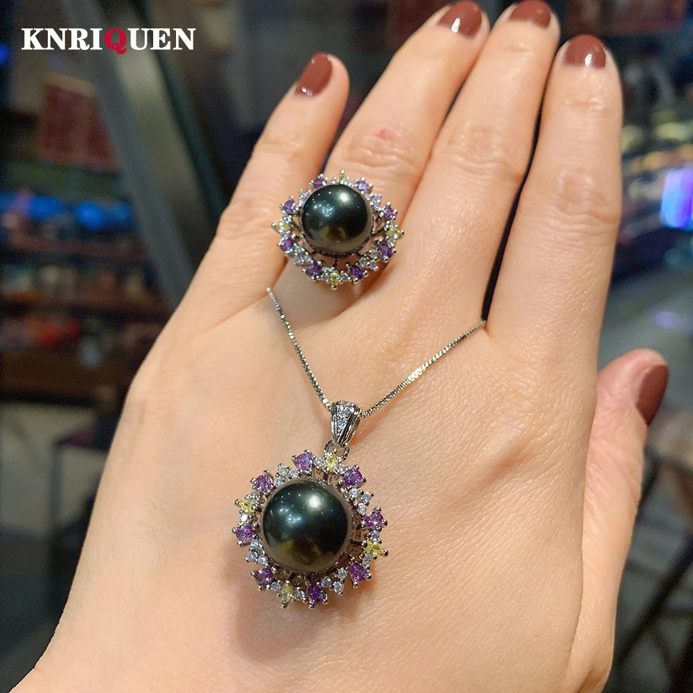 

Женский комплект из колье и серёг, из серебра 925 пробы, с черным жемчугом 12 мм