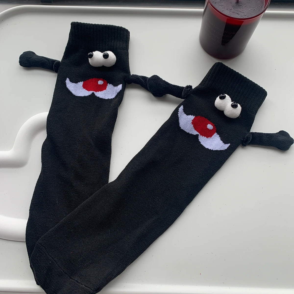 

CHAOZHU 1 Pair Black Santa Claus Holding Socks Built-in Magnet Magnetic Suction Handle Funny Xmas Gift Tube Socks Family Friends