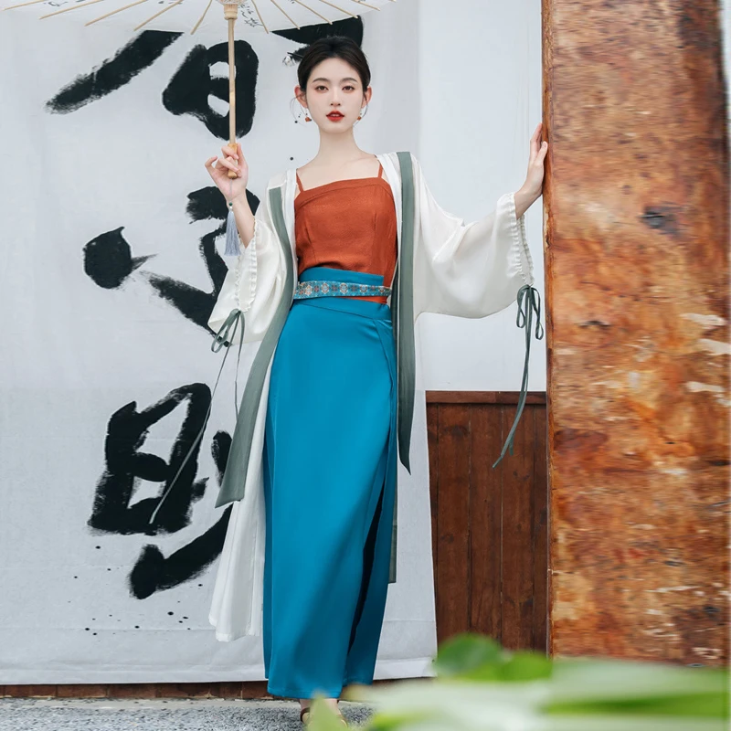 

Johnature Chinese Summer New Improved Hanfu Sets Women Wide Sleeve Long Shirt Jacquard Top Hanging Strap Bandage Skirt Sets 2023