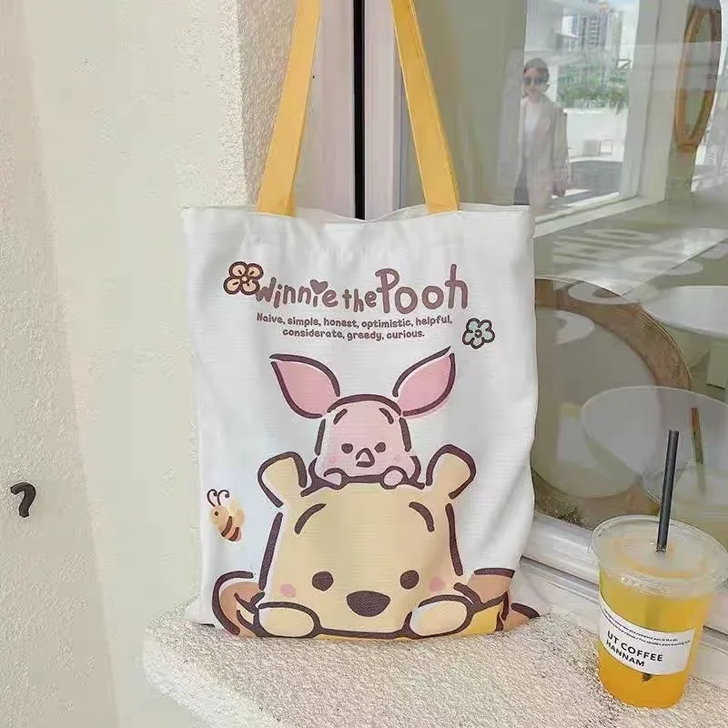 

Disney Student Versatile Cartoon Winnie The Pooh Canvas Bag Large Capacity Book Bag Handbag Going Out Mom Commuting Bag