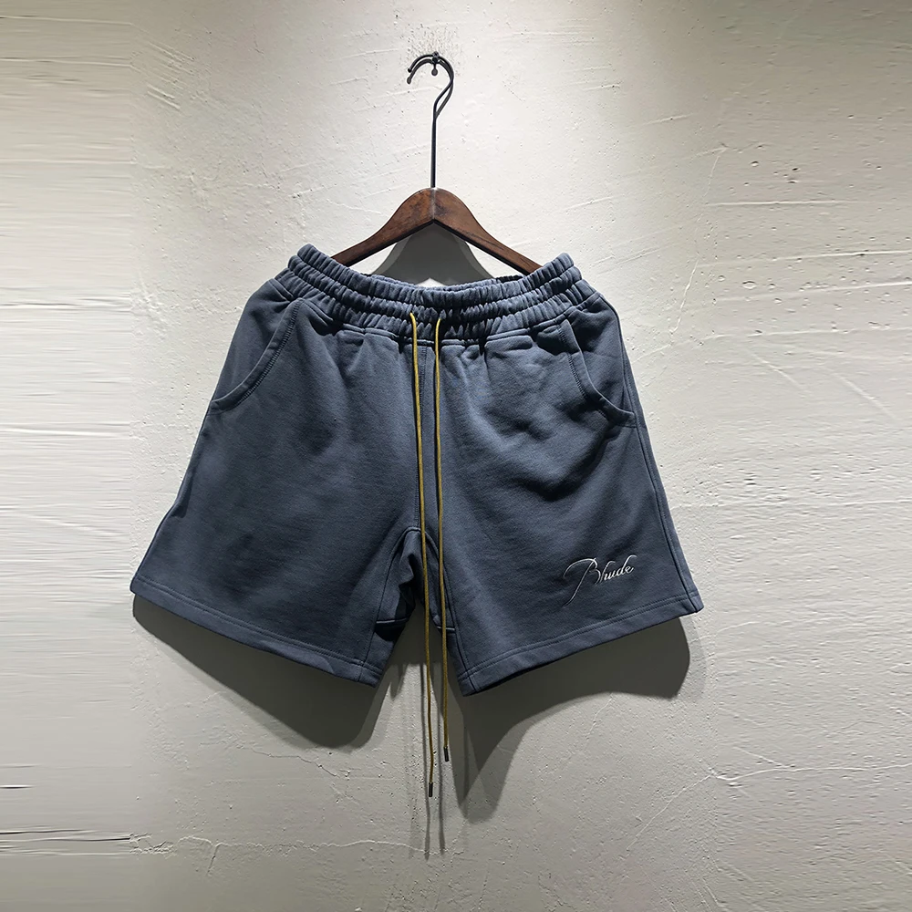 

Rhude Shorts High Quality 1:1 Letter Emboridery Drawstring Shorts Men's High Street Loose Shorts Cotton Elasticity Wasit Shorts