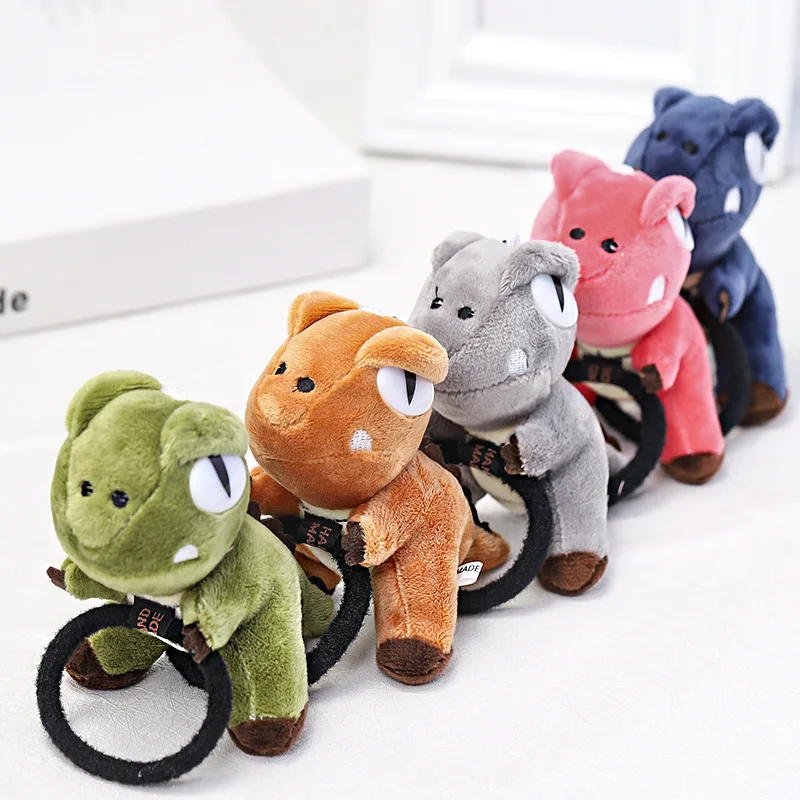 

Резинка для волос в виде симпатичного маленького динозавра