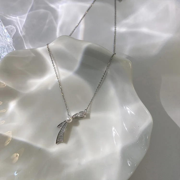 

Korean Pearl Neck Chain 925 Sterling Silver Bow Hip Hop Style Necklace Female Minority Design Clavicle Chain New Style