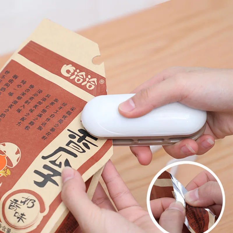 

Лидер продаж, лучшая портативная Бытовая мини-машина для запечатывания, теплоизолятор, укупорочная машина для хранения продуктов в пластик...