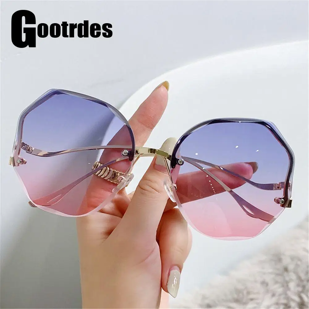 

Очки солнцезащитные женские без оправы, с изогнутыми дужками, в металлической оправе