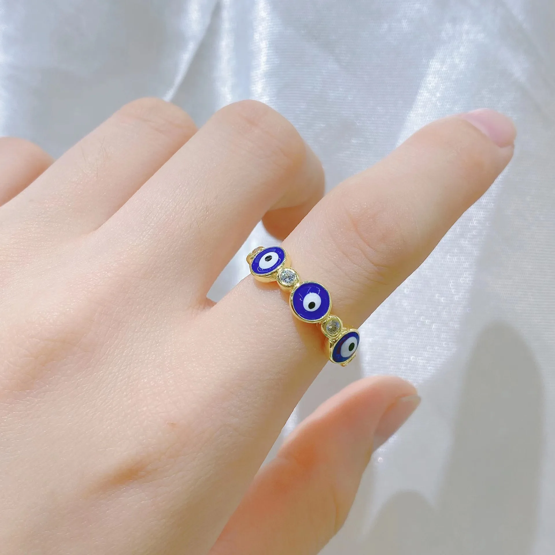 

European and American fashion sweet punk style niche design sense zircon jewelry drop oil colored eye opening adjustment ring op