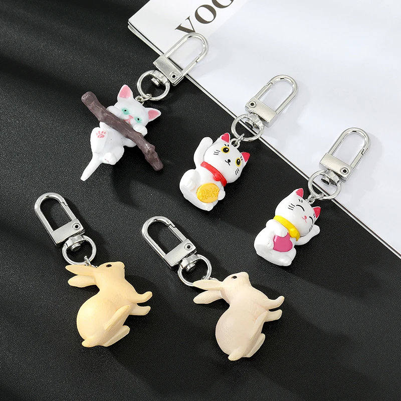 

Cute Animal Cat Bite Branch Keychain Keyring For Women Men Kids Gift Cartoon Lucky Cat Rabbit Phone Charms Car Bag Jewelry