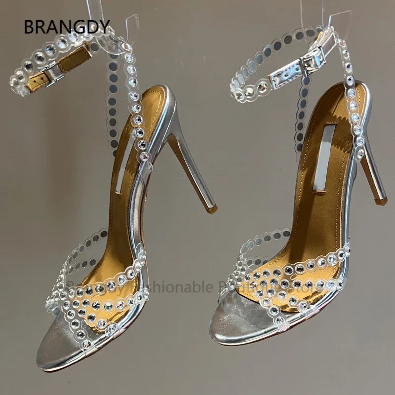 

2022 PVC Cutout Transparent Buckle Ankle Sandals Peep Toe Colourful Gems Laser High Heels Mules Summer Women Party Wedding Shoes