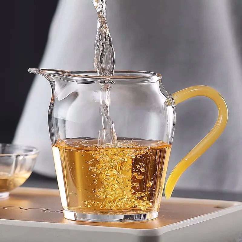 

Glass justice cup color handle thickened bottom glass tea sea transparent glass tea dispenser jade handle male cup