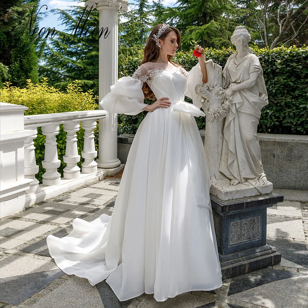 

Intriguing Sheer O Neck Pleats Wedding Dress Lace Appliques A Line Bow Bridal Gowns Lace Up Back Sweep Train Vestidos De Novia