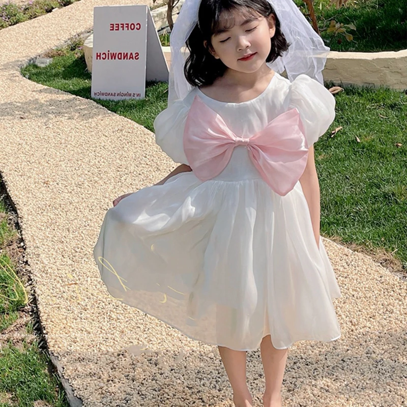 

VigoAnne платья с короткими рукавами для девочек с буфами 2022 летнее корейское однотонное платье с бантом детская одежда с открытой спиной для д...