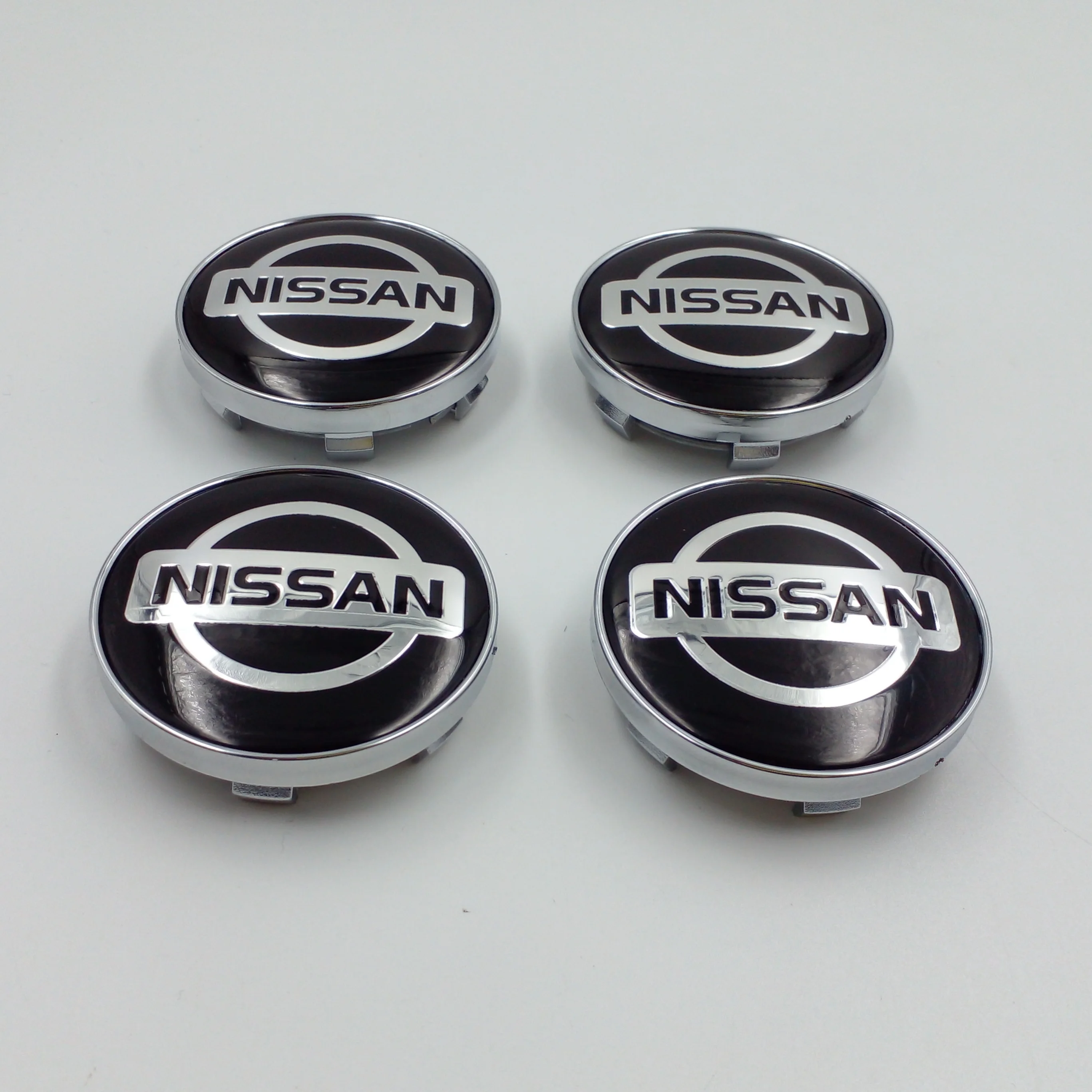 Заглушки литых дисков ниссан 70мм. Колпачки заглушки ниссан. Колпачки заглушки ниссан. Заглушки на диски nissan r 14. Колпачки заглушки ниссан.