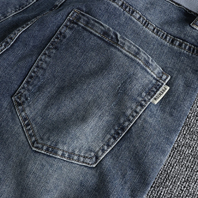 With a belt, vintage blue jeans, slim fit, snug little bullet hole, teeny feet