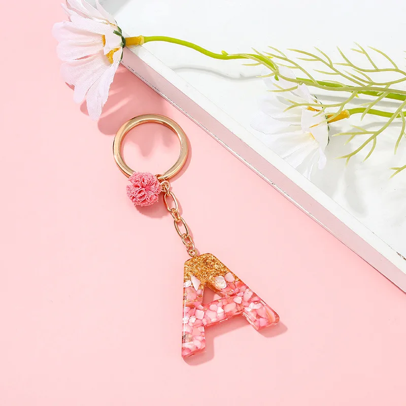 

Pink Pompom English Alphabet Charms Keychains For Women Golden Foil Resin Letter Pendant Keyring Girl Bag Key Chain Jewelry Gift