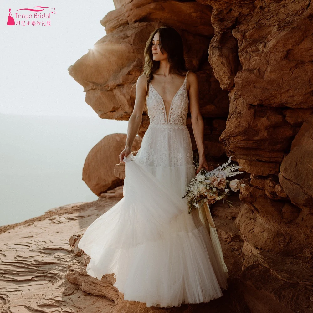 

Deep V-Neck A Line Wedding Dresses Tired Skirts Boho Bridal Gowns Backless Floor Length Noivac Chic ZW697