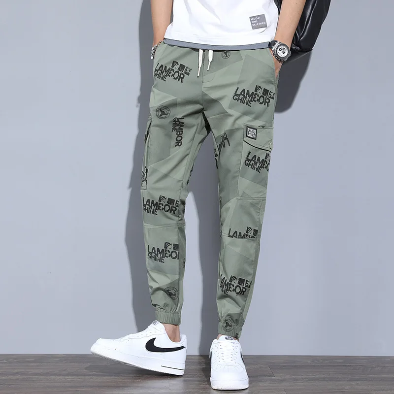 

Spring and summer new printed camouflage overalls men's slim Korean version of the leggings tide brand nine-point casual pants