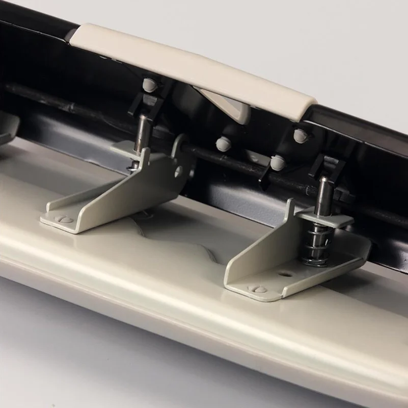 Металлический дырокол с 4 отверстиями и 25 листовми бумаги регулируемые