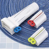new toothpaste squeezer toothpaste seat holder stand rolling tube facial cleanser dispenser press for bathroom accessories gifts