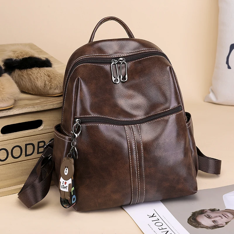 

New Fashion Women Multifunctional Casual Backpack Female Large Capacity Solid Color Satchel with Bear Pendant for Girls Backpack