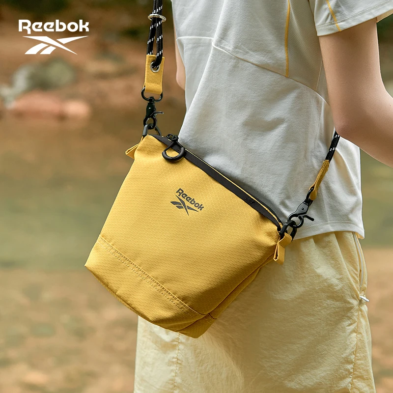 Фото REEBOK Корейские легкие сумки-мессенджеры через плечо для мужчин и женщин, повседневные маленькие сумки-слинг, женская сумка-ведро для телефона №1