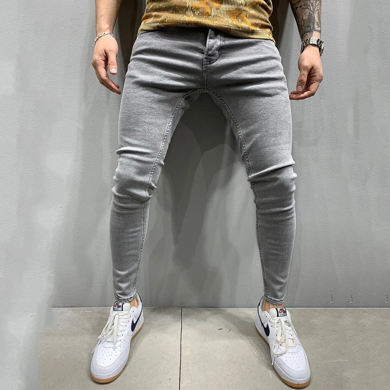 Europe and the United States new wish men's pants ripped white loose denim trousers fashion pencil pants Stylish casual jeans