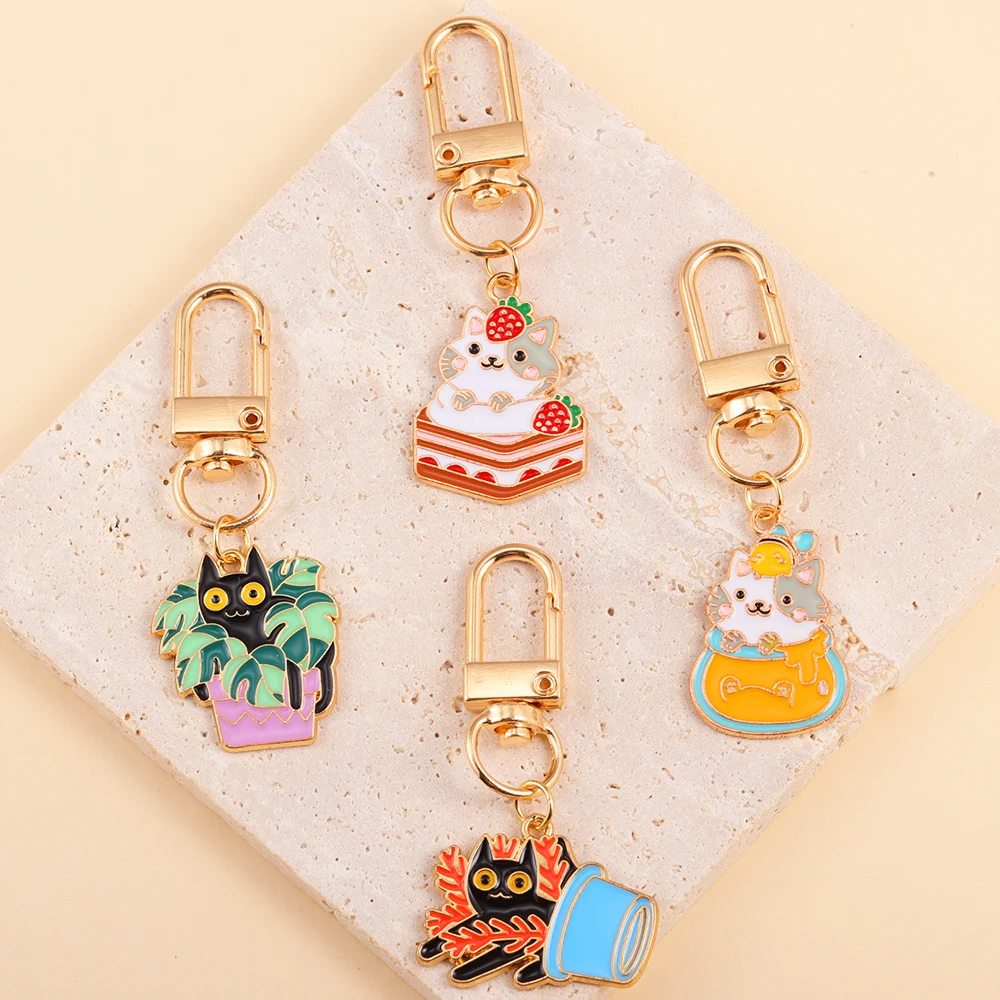 

Kawaii Metal Enamel Cake Cat Charms Keychains Cute Kitty Animal Key Holder For Women Men Handbags Car Key Decor Party DIY Gifts