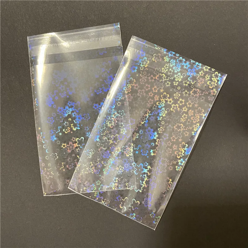 

100pcs/Lot Flower-shaped Laser Flashing Sealing Card Sleeves For Board Game Cards Holder Holographic Foil Protective Film