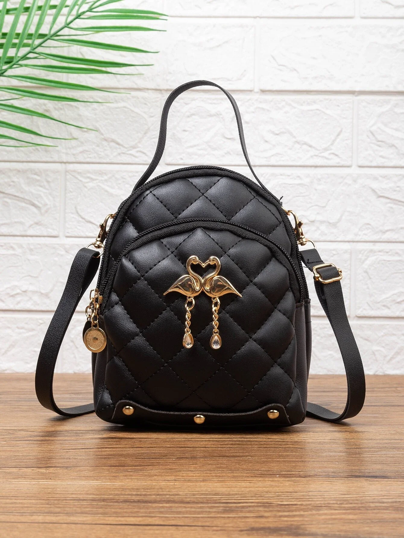 

Mini Quilted Curved Top Backpack