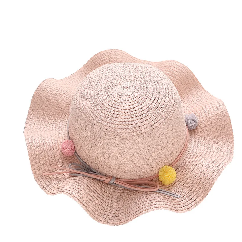 Детская шляпа весенне-летнего сезона простая, дико-симпатичная с декором помпонов, защитой от солнца и короткими полями для девочек из соломенной соломы.