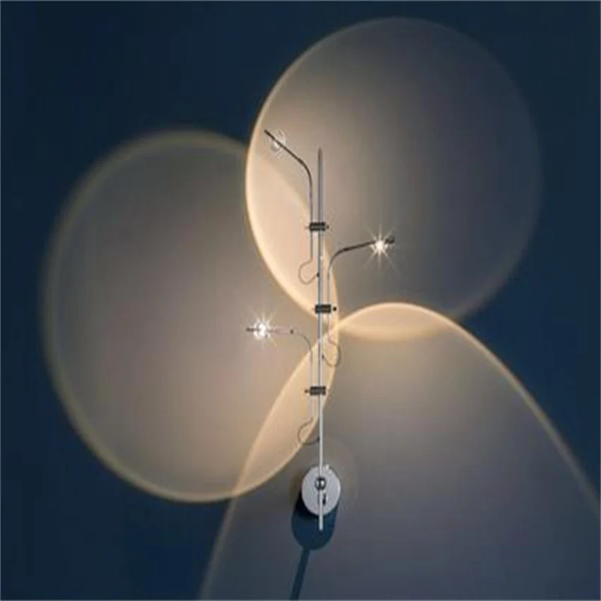 

Three-Head Led Rotatable Light and Shadow Decorative Wall Lamp, Made of Silver Stainless Steel, Used In Indoor Rooms.